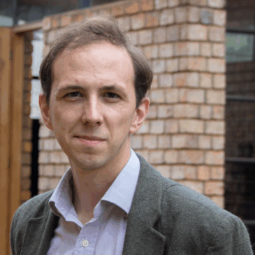 Gabriel Schenk's endearing asymmetrical smile belies the razor sharp mind behind the man raised in the airs of Oxford.