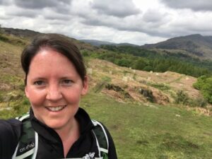 Dr. Maggie Parke greets you from the green hills of Wales. She's got an outdoorswoman's tan, swept-back dark hair, and a cheerful apple-cheeked smile.